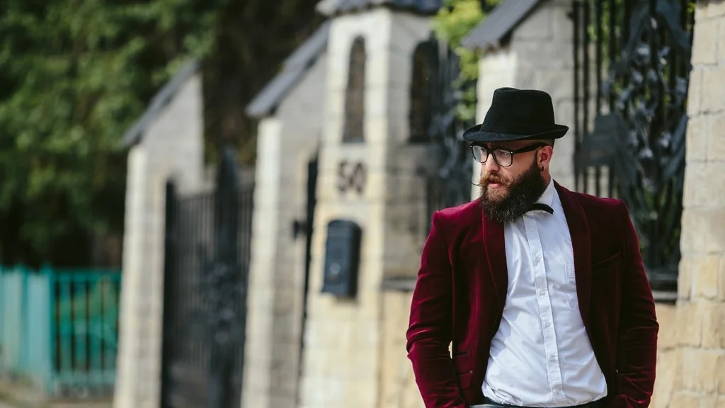 Men wearing red suit with black hat